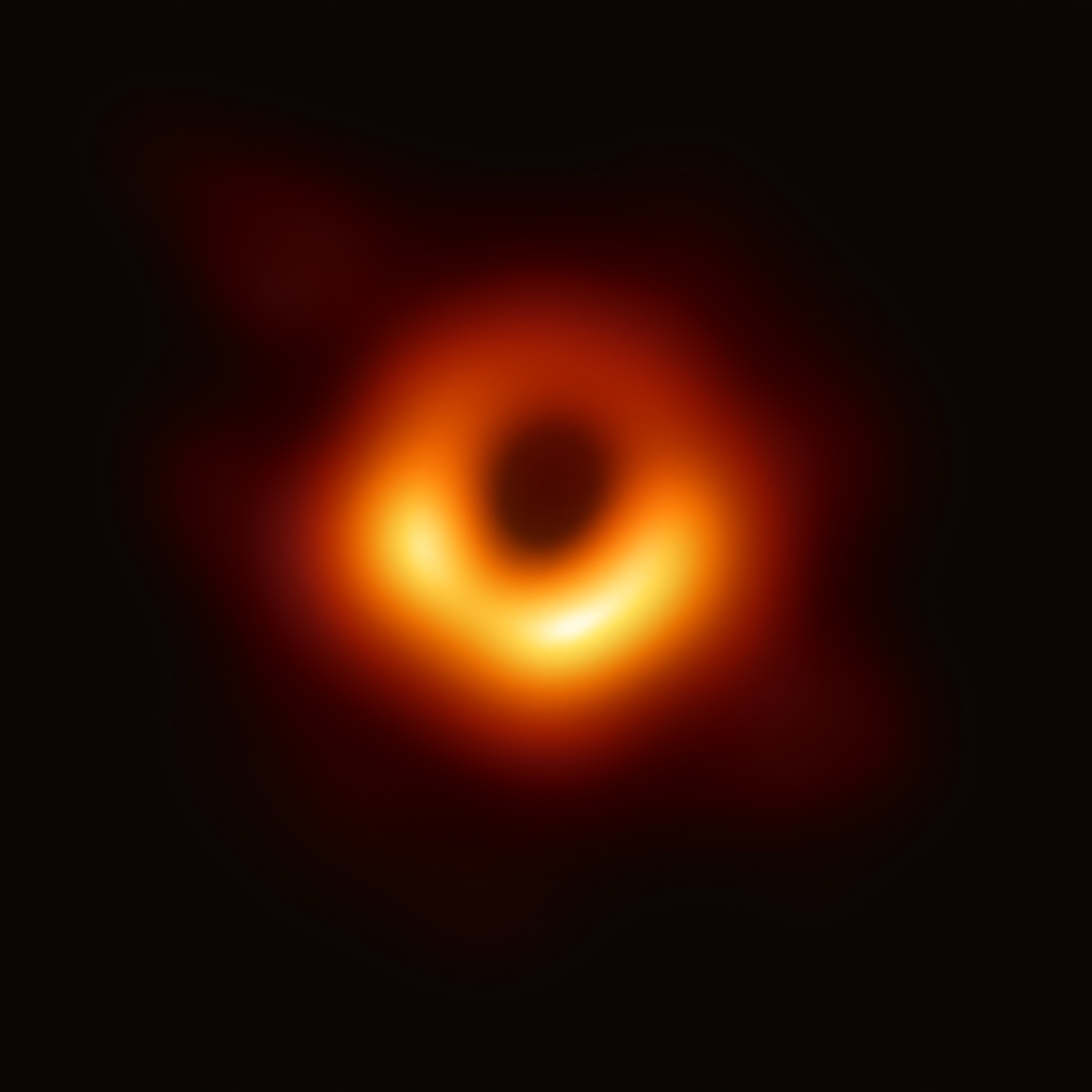 The Event Horizon Telescope's 2019 image of the supermassive black hole in galaxy M87: a bright orange ring of light around a dark central shadow