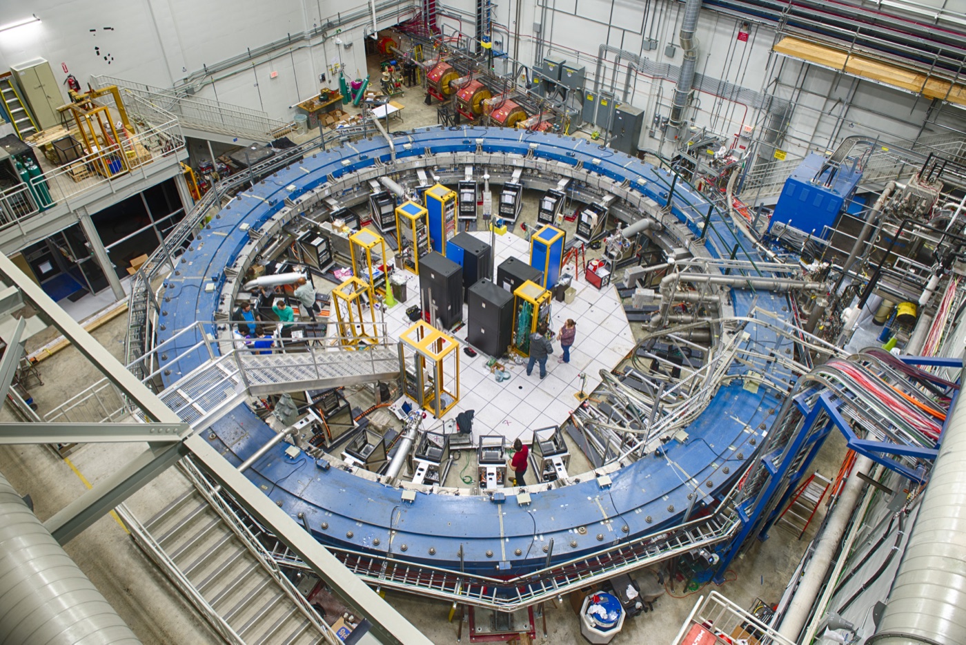 The Muon g-2 storage ring at Fermilab: a large blue circular superconducting magnet ring inside its experimental hall