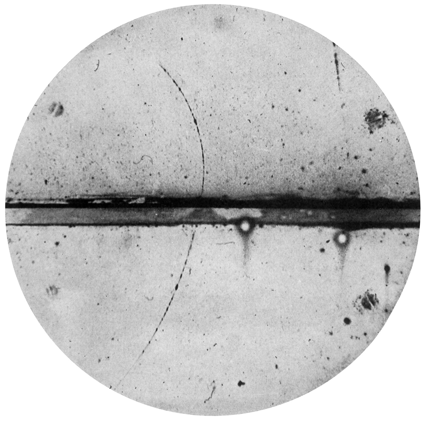 Carl Anderson's 1932 cloud chamber photograph of a positron track curving across a lead plate
